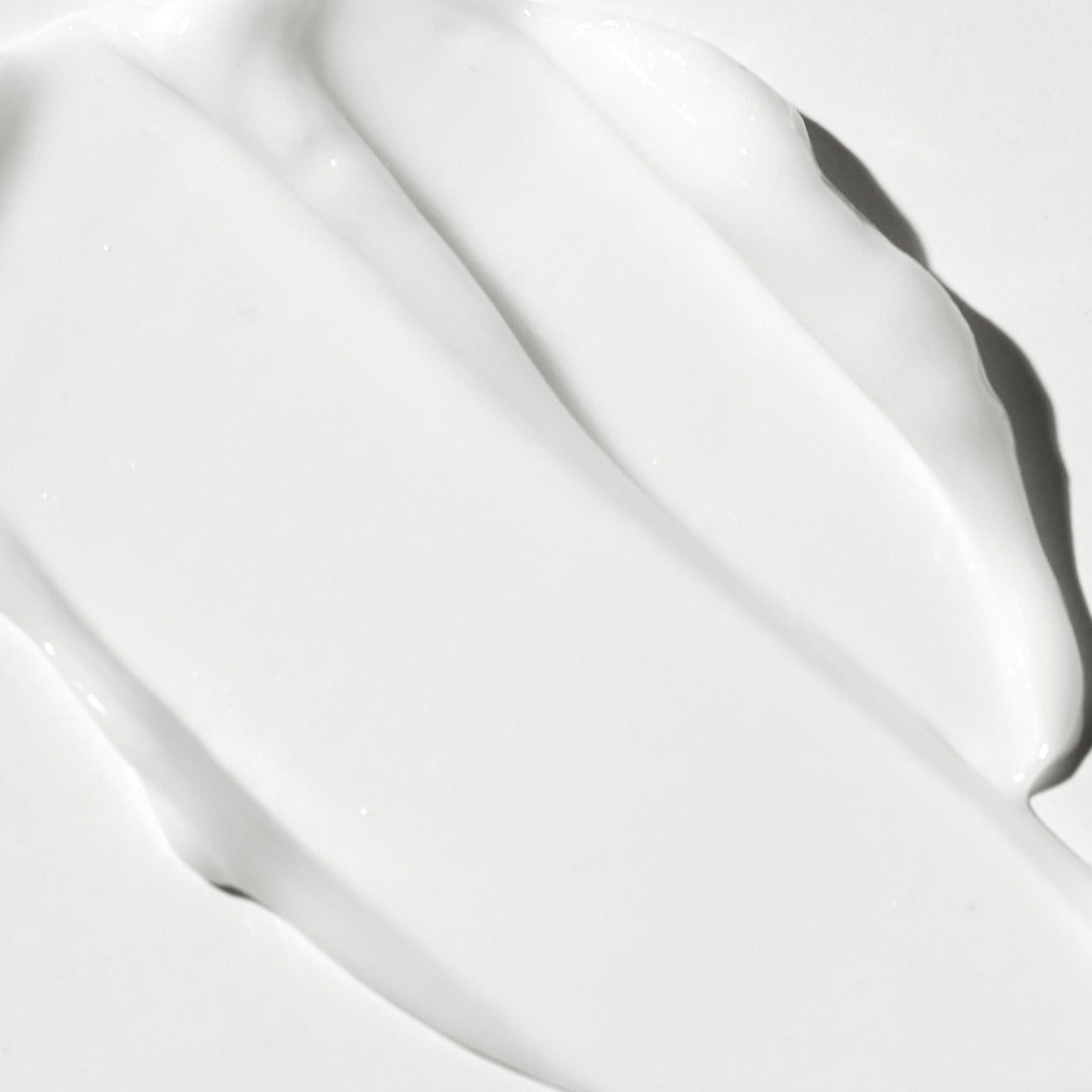 Texture of VT COSMETIC PDRN Riddle Shot Cream 50ml showcasing creamy consistency on a smooth surface
