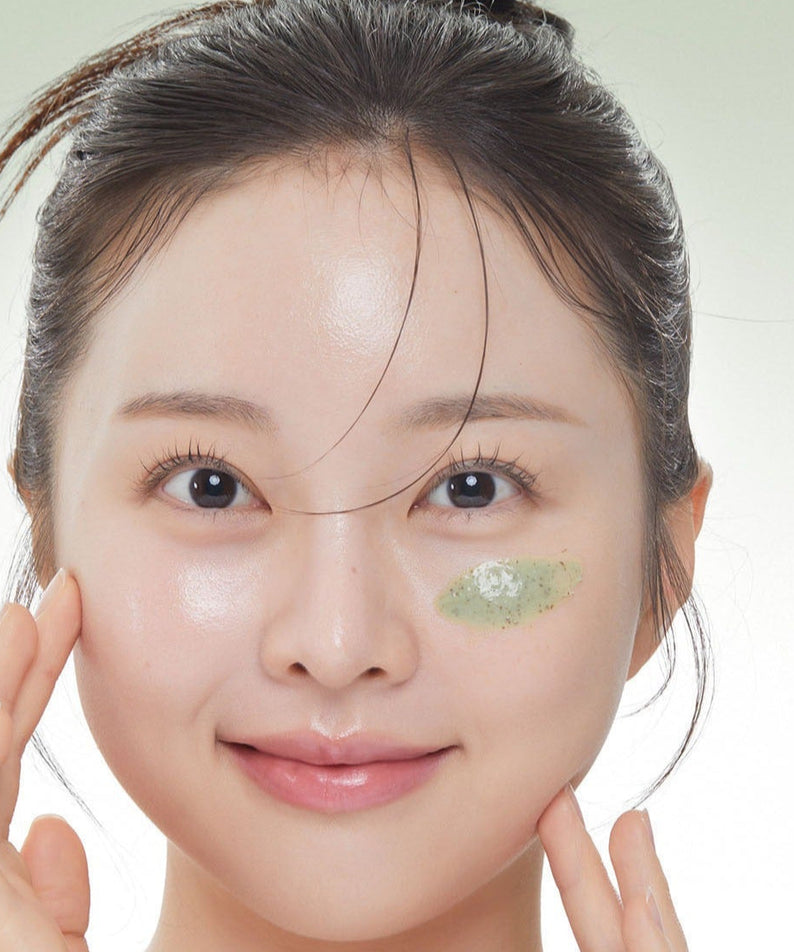 Woman applying VT COSMETIC Cica Mask Cleanser 120ml on her face, demonstrating skincare routine.