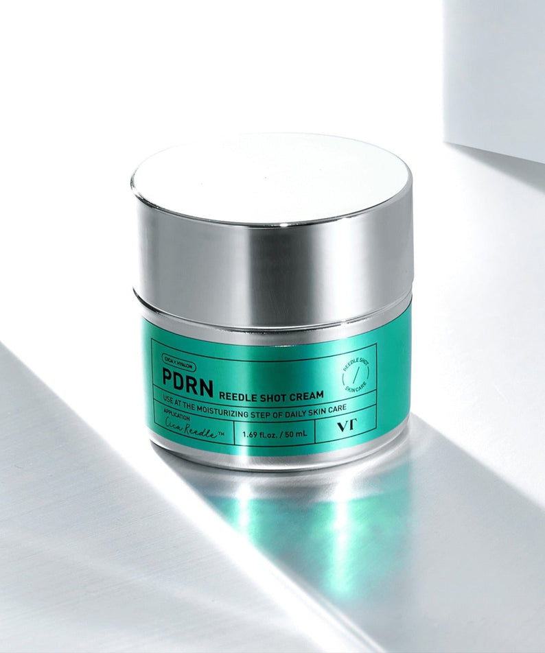 VT COSMETIC PDRN Riddle Shot Cream 50ml jar on reflective surface with vibrant green label for advanced skincare