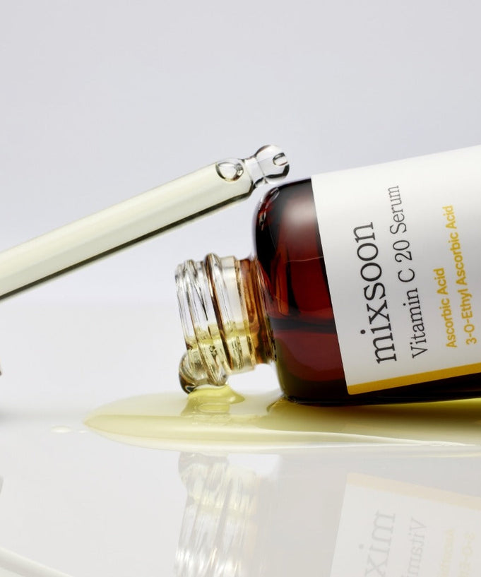 MIXSOON Vitamin C 20 Serum 10ml bottle with dropper spilling serum, showcasing product label and texture.