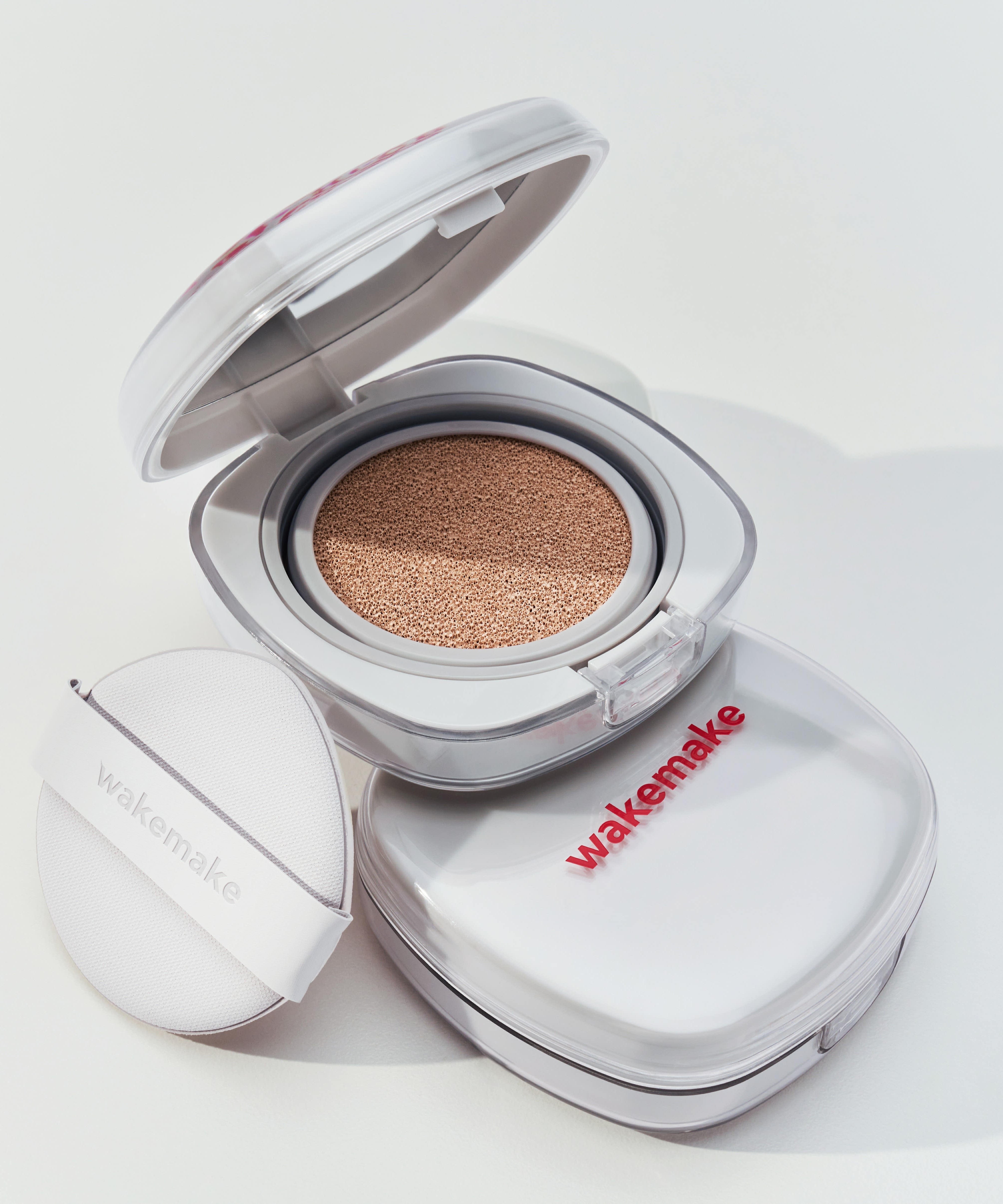 WAKE MAKE Seamless Wear Cushion 15g opened to show cushion texture, highlighting makeup compact design
