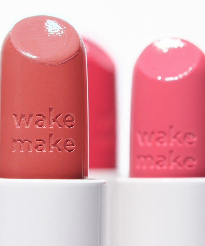 Close-up of WAKEMAKE Healthy Glow Balm Sticks in vibrant pink and coral shades.