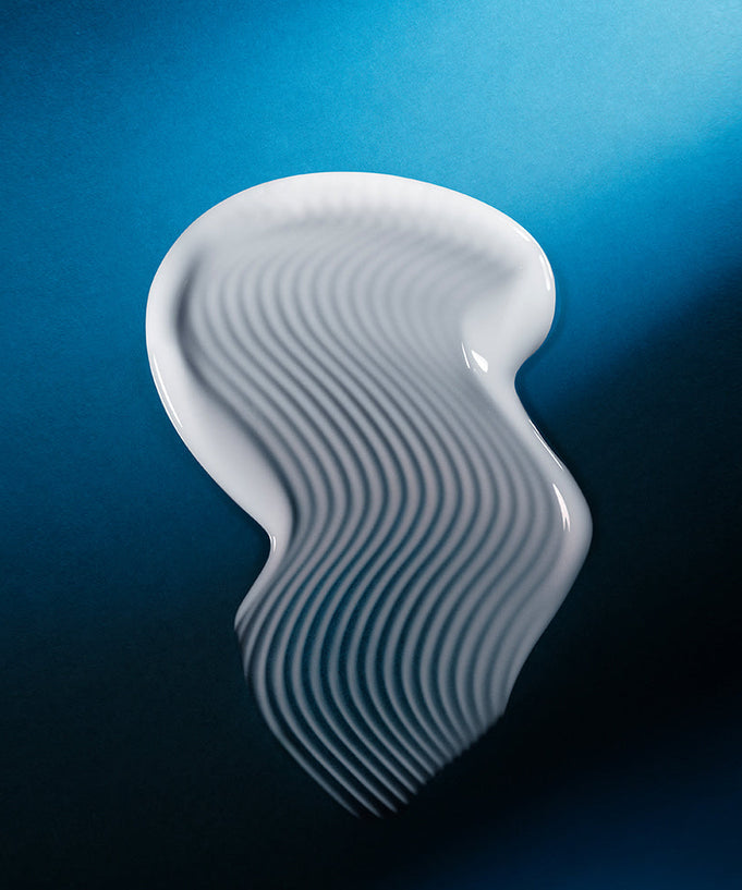 Texture of WELLAGE Hyper Peptide Bandage Cream 50ml on blue background