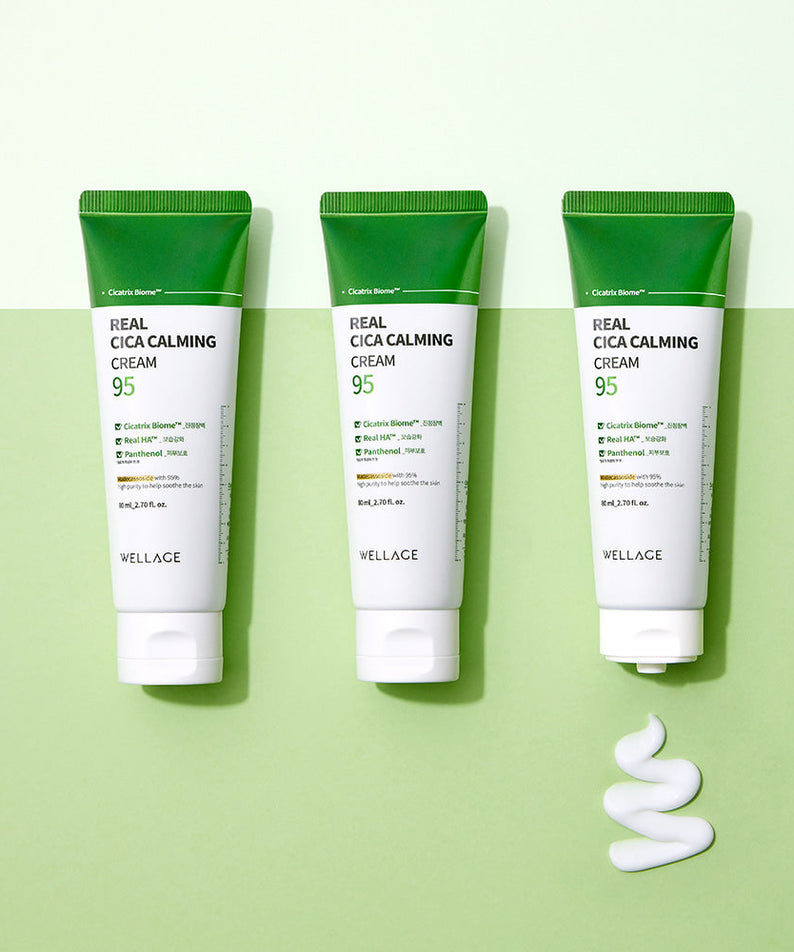 WELLAGE Real Cica Calming 95 Cream 80ml tubes on a green background with cream texture.