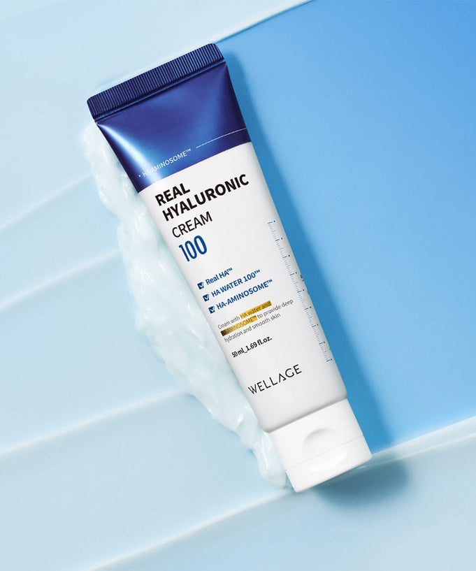 WELLAGE Real Hyaluronic 100 Cream 80ml on a blue background showcasing packaging design