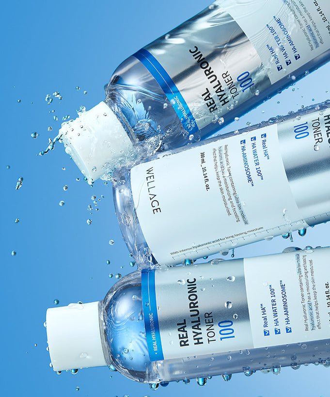 WELLAGE Real Hyaluronic 100 Toner 200ml bottles with water droplets on a blue background, showcasing skincare and hydration focus.