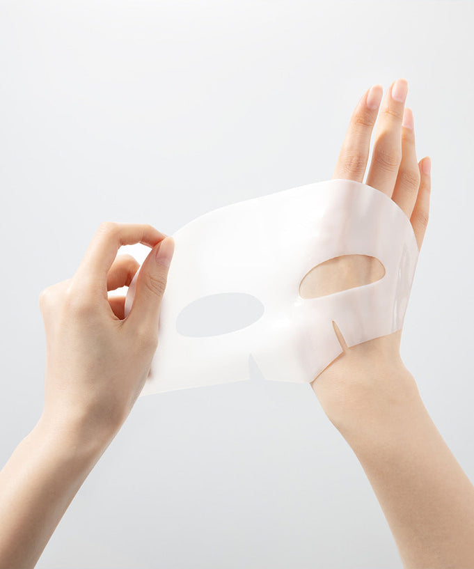 Hands holding WELLAGE Real hyaluronic Glow Booster PDRN Mask 5 Sheets