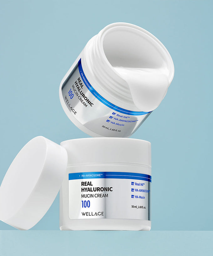 WELLAGE Real Hyaluronic Mucin Cream 50ml in white packaging displayed on a blue background
