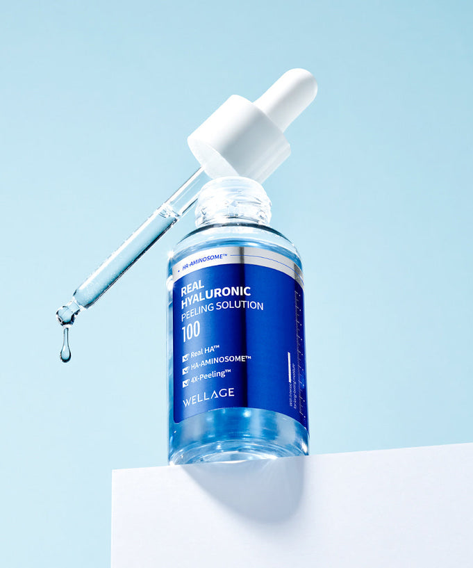 WELLAGE Real Hyaluronic Peeling Solution 30ml bottle with dropper against a blue background.