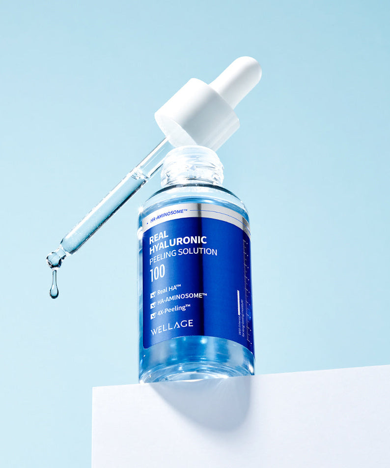 WELLAGE Real Hyaluronic Peeling Solution 30ml bottle with dropper against a blue background.