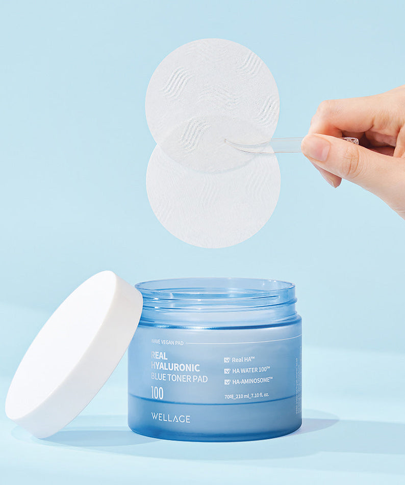 Container of WELLAGE Real hyaluronic Blue Toner Pads 70 Sheets with a hand lifting pads, ideal for skincare routine and hydration.