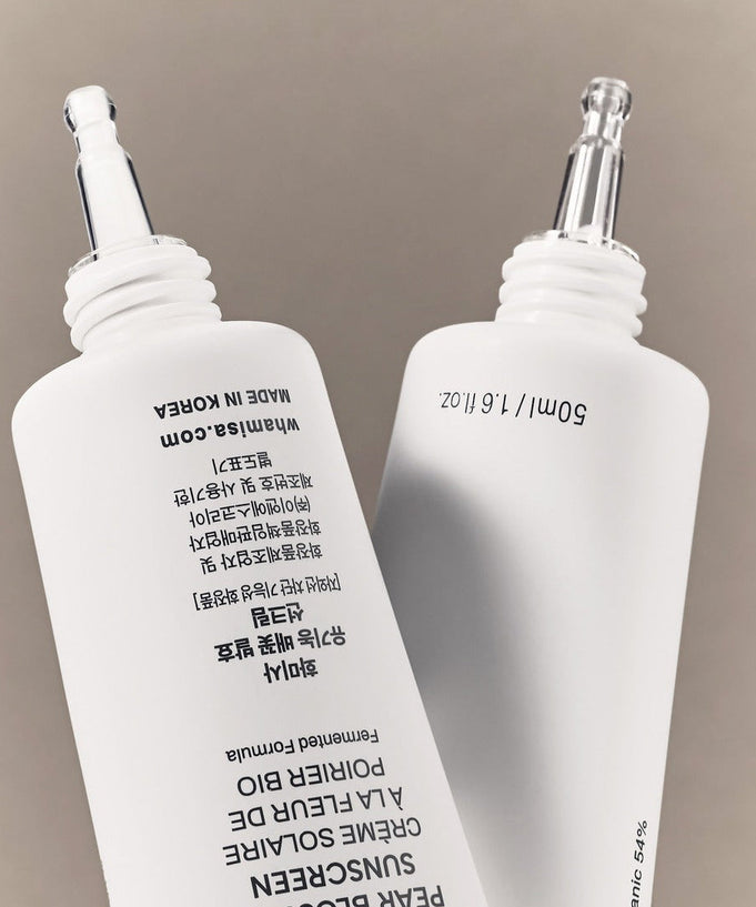 WHAMISA Organic Pear Blossom Fermented Sunscreen 50ml bottles with applicator tips