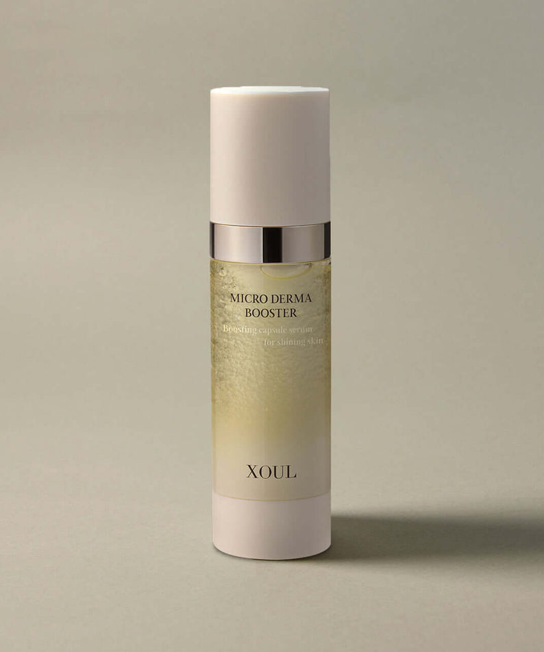 XOUL Micro Derma Booster 30ml serum bottle on an elegant neutral background