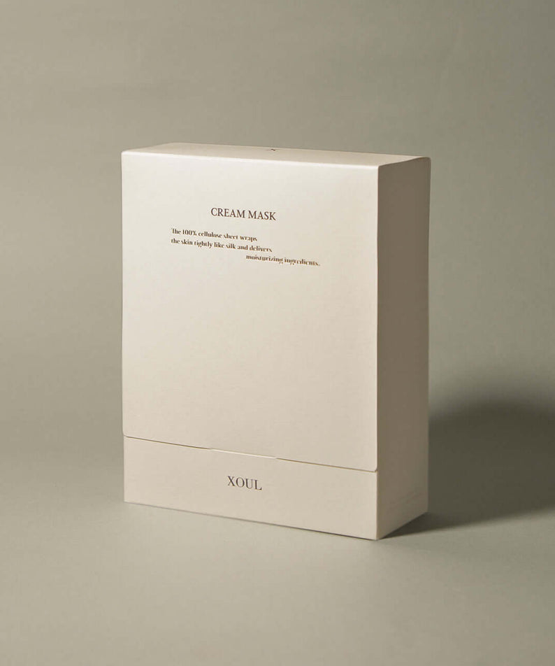 XOUL Secret Solution Cream Mask 15p packaging with beige box showcasing product design and branding features in ambient lighting.
