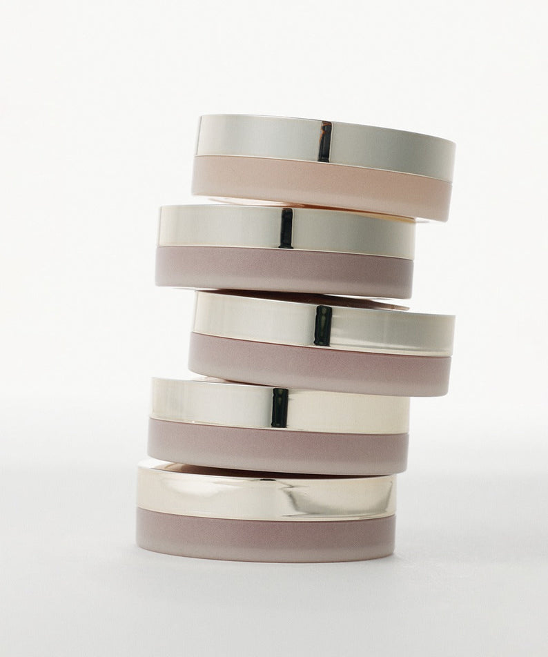 Stack of XOUL Ever Moist Volume Lip Balm 8g in silver and beige packaging