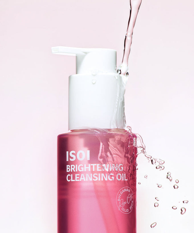 ISOI Brightening Cleansing Oil 150ml bottle with water splash on pink background