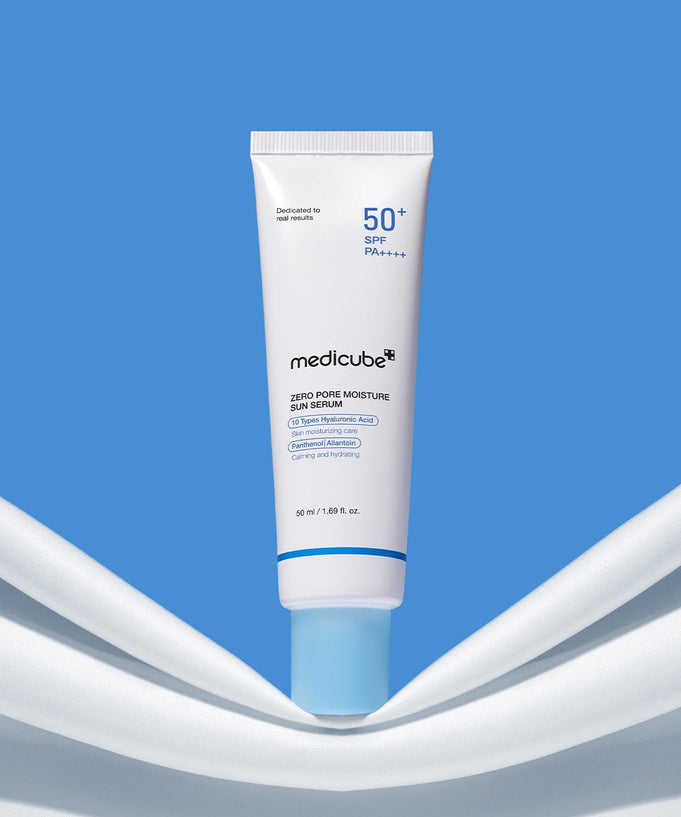 MEDICUBE Zero Pore Moisture Sun Serum 50ml in blue and white packaging against a blue background.