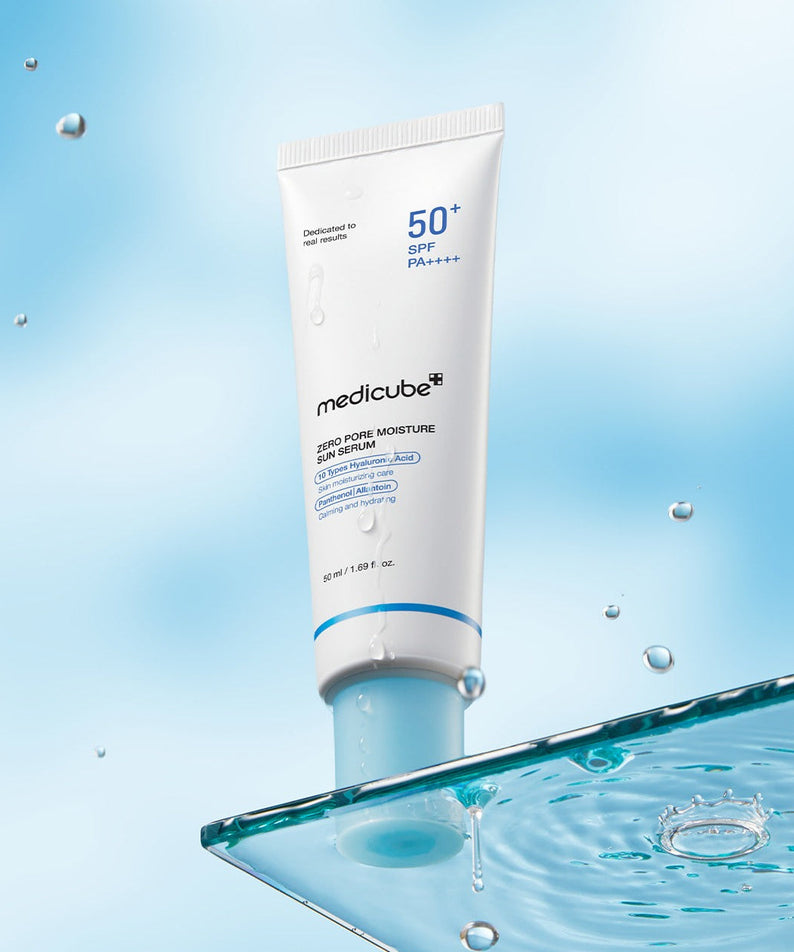 MEDICUBE Zero Pore Moisture Sun Serum 50ml with SPF 50+ on a reflective surface with water droplets