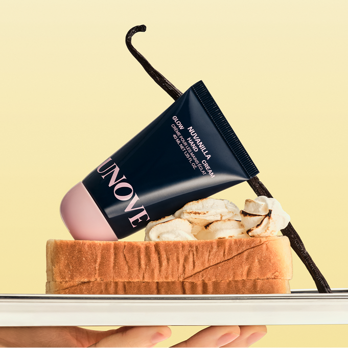 UNOVE Glow Hand Cream 40ml resting on toast with marshmallows and vanilla stick, showcasing its luxurious and moisturizing properties.