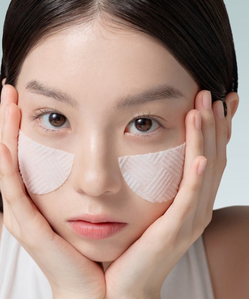 Woman using ABIB Green LHA Pore Pad Clear Touch 60 Sheets on face for skincare.