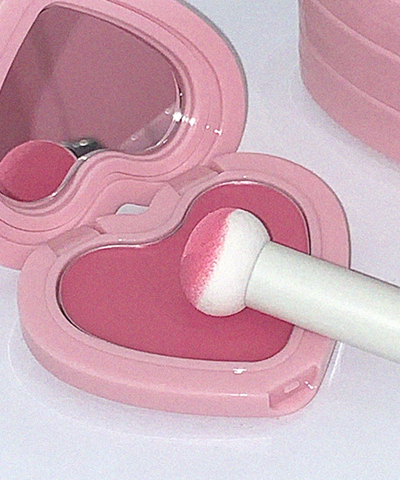 AOU Soft Cream Blush in heart-shaped pink compact with applicator for a natural, soft glow.