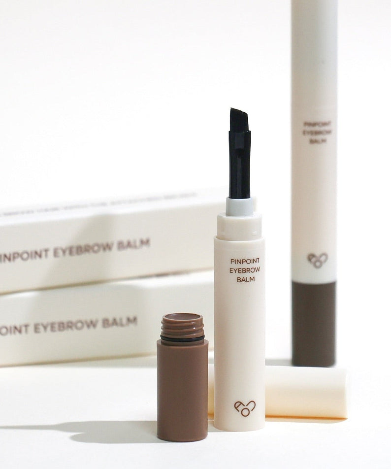 AOU Pinpoint Eyebrow Balm with open tube and brush displayed on a white background, ideal for precise brow styling.