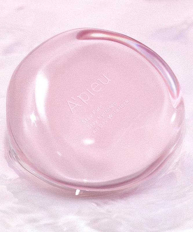 A'PIEU Waterlock Comfort Veil Cushion 15g in pink, floating on water, showcasing its sleek, reflective design.