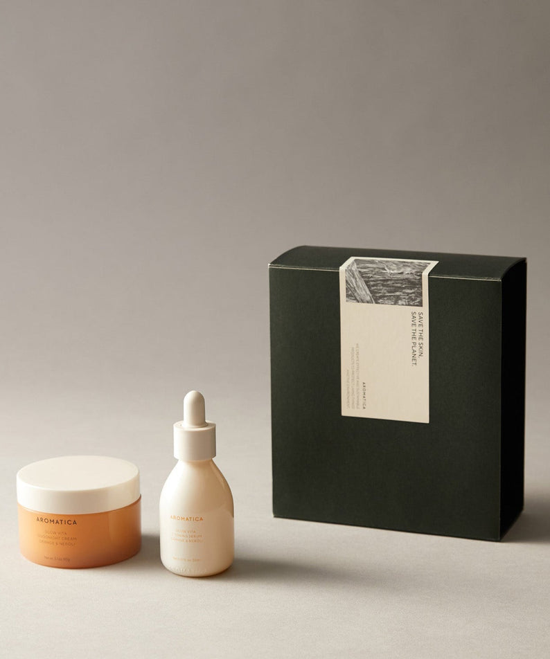 AROMATICA Glow Vita Toning Serum & Good Night Cream Set displayed with elegant packaging on neutral background