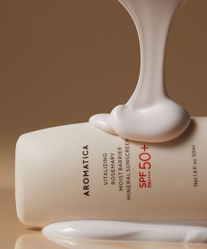 AROMATICA Vitalizing Rosemary Moisture Barrier Sunscreen 50ML tube with cream texture spilling over, SPF 50+ prominently displayed.