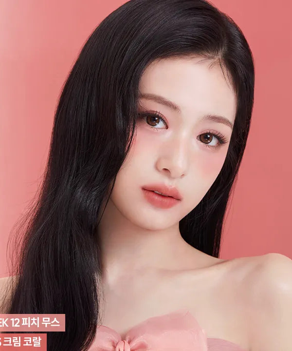 Woman wearing BANILA CO Romantic Blush Lip & Cheek in a soft pink shade.