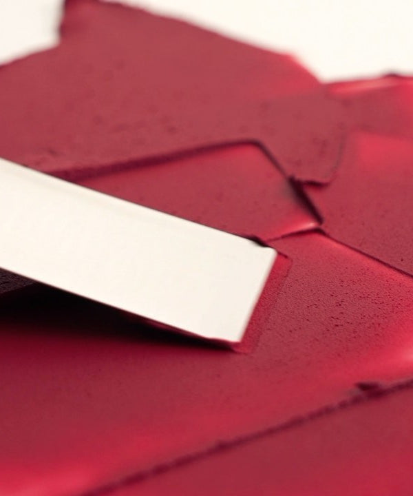 BANILA CO New Sheer Velvet Veil Tint swatch showing rich and creamy texture in a vibrant shade, perfect for a smooth lip finish.