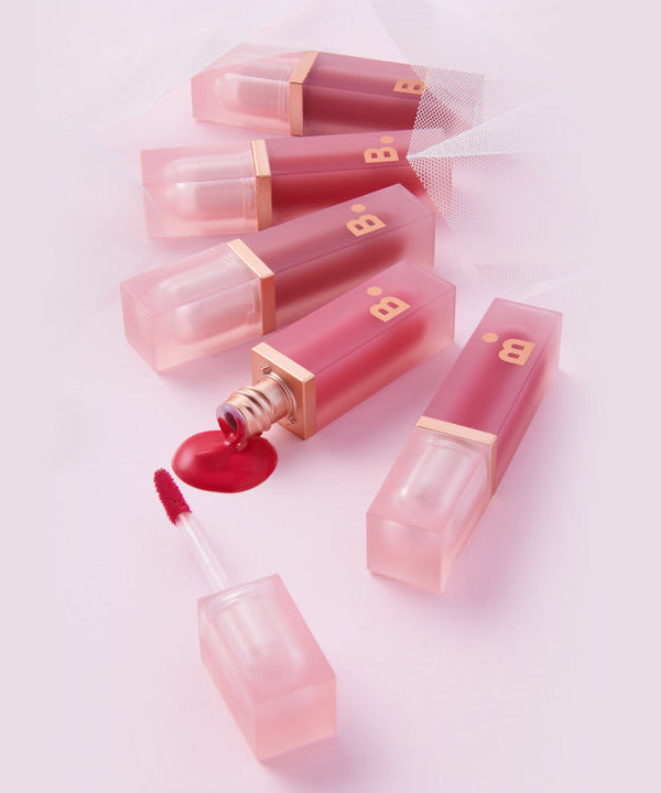 BANILA CO Water Drop Veil Tint in elegant packaging, featuring multiple shades and open tube displaying product texture.