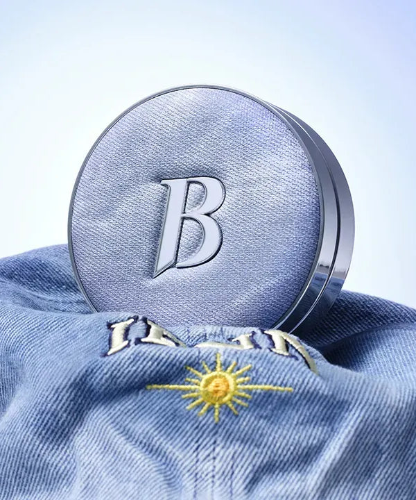 BANILACO Covericious Ultimate White Cushion on denim with embroidered sun design