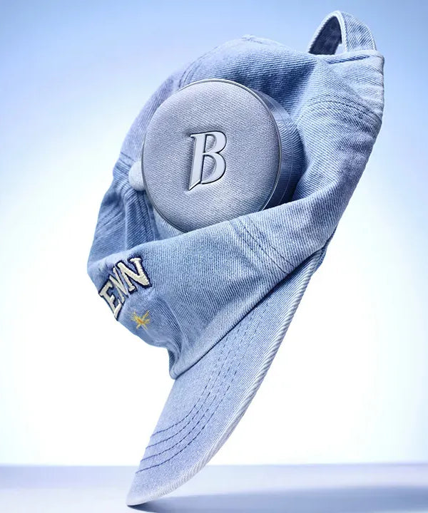 BANILACO Covericious Ultimate White Cushion displayed with a blue denim cap for a stylish look.