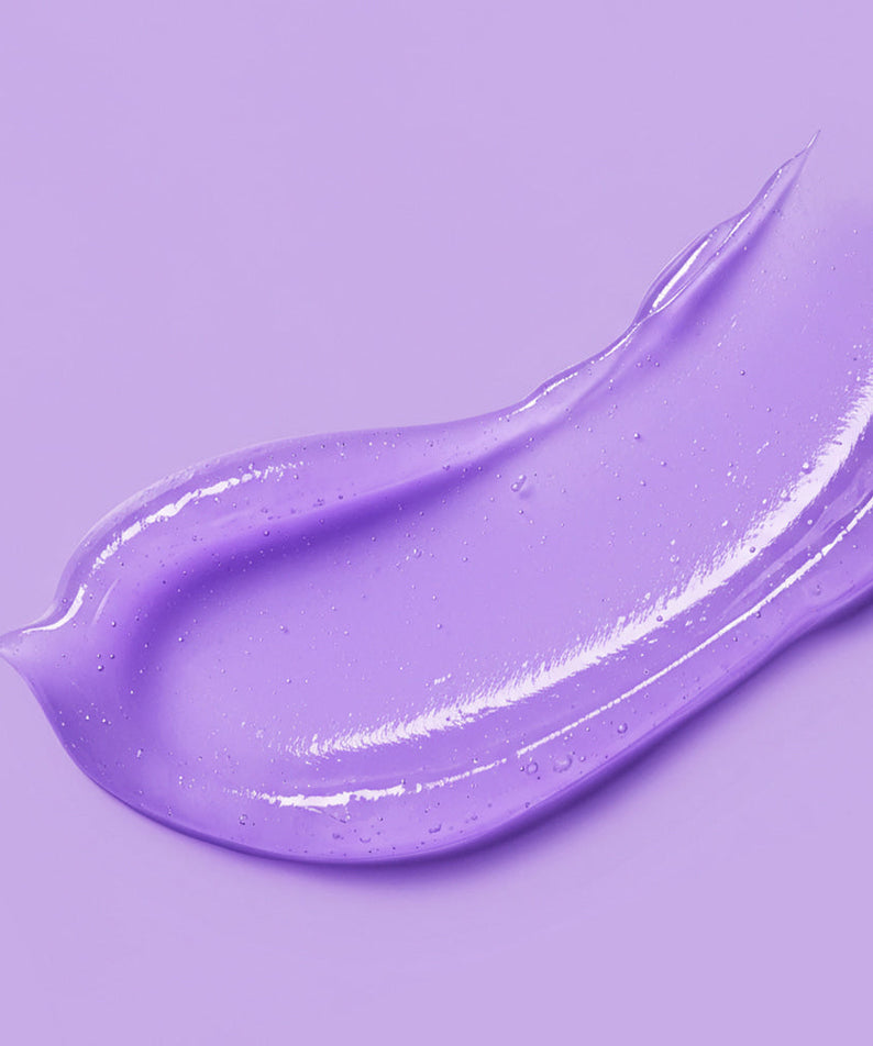 Purple smudge texture of BARULAB Bakuchiol Peptide Smooth Lip Serum 10g on purple background