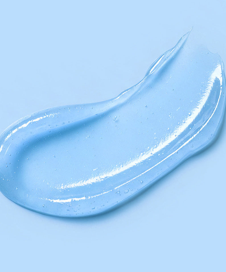 Close-up of BARULAB Hyaluronic Panthenol Moisturizing Lip Serum 10g texture on light blue background