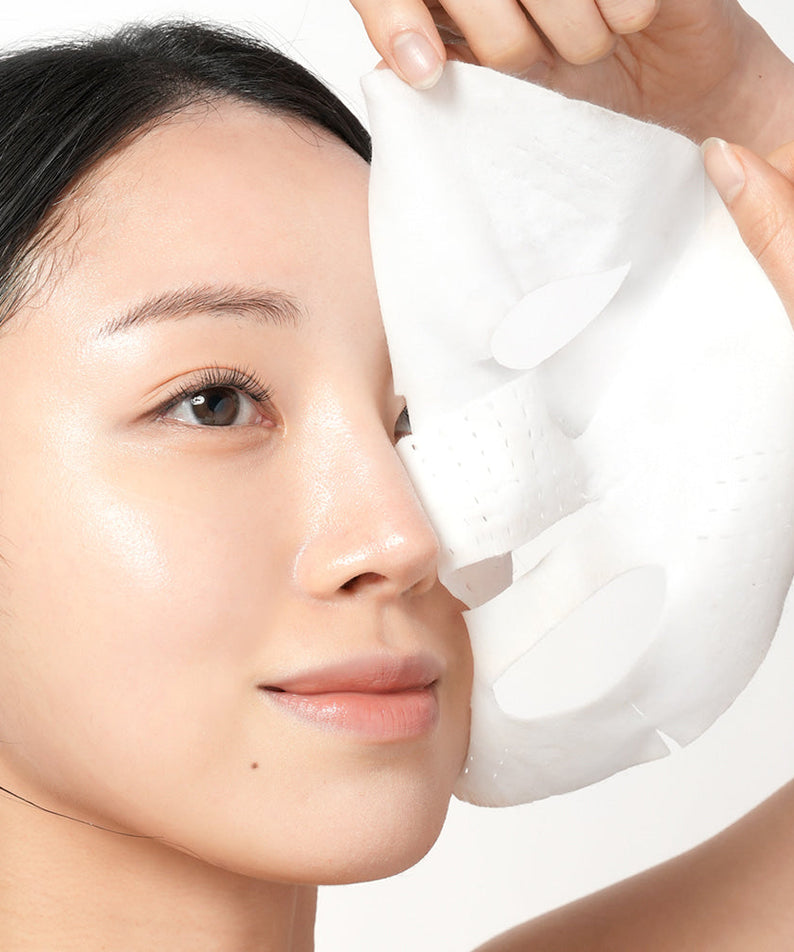 Woman applying BARULAB Rice Makgeolli Probiotic Yeast Cream In Mask 5 Sheets for skincare routine.