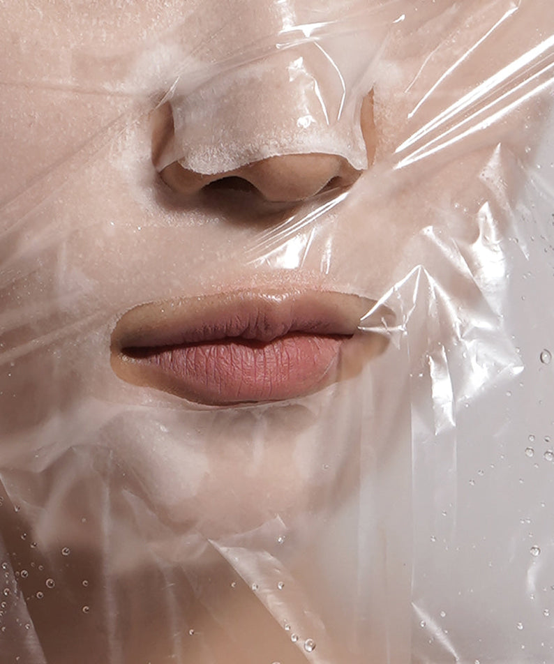 Close-up of BARULAB Steam Sheets Moisture Shield Oil Lock Facial Mask 5 Packs on skin for hydration and moisture lock.