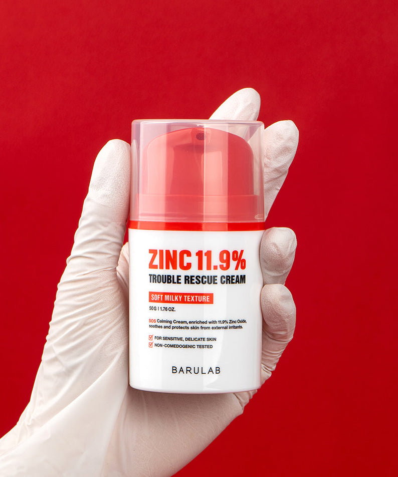 BARULAB Zinc 11.9 Percent Trouble Rescue Cream in hand, red background