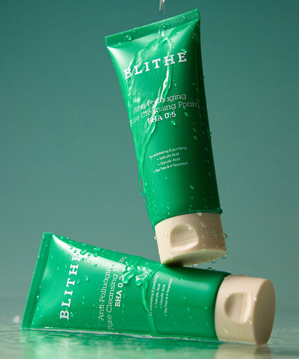 BLITHE Anti-Pollution Aging Pore Cleansing Foam BHA 0.5 150ml tubes on a green background with water droplets