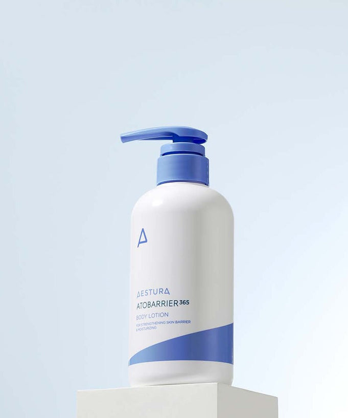 AESTURA Atobarrier 365 Body Lotion 400ml bottle on display against a light blue background.