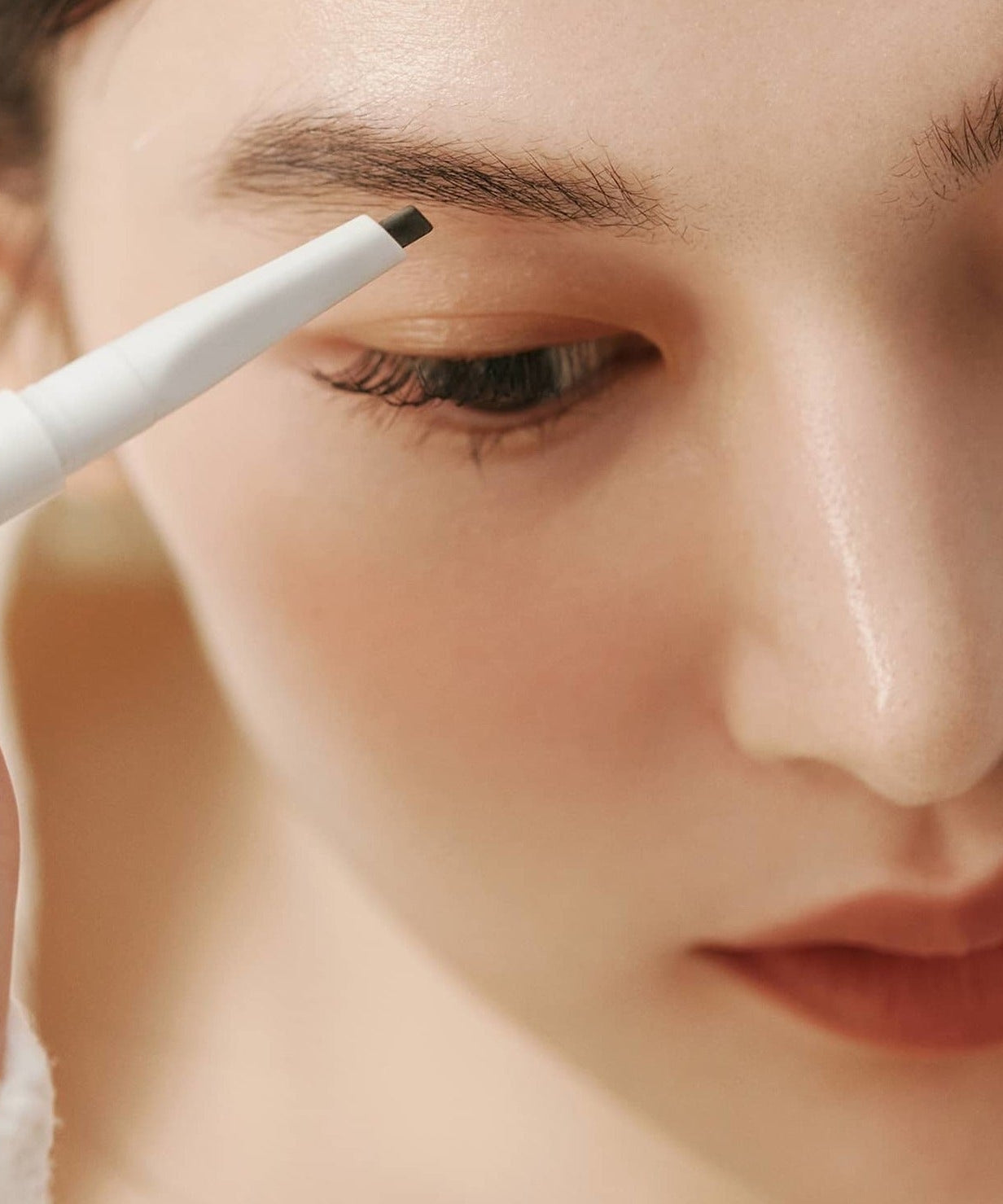 HINCE Signature Brow Pencil applied to eyebrow for precise shaping