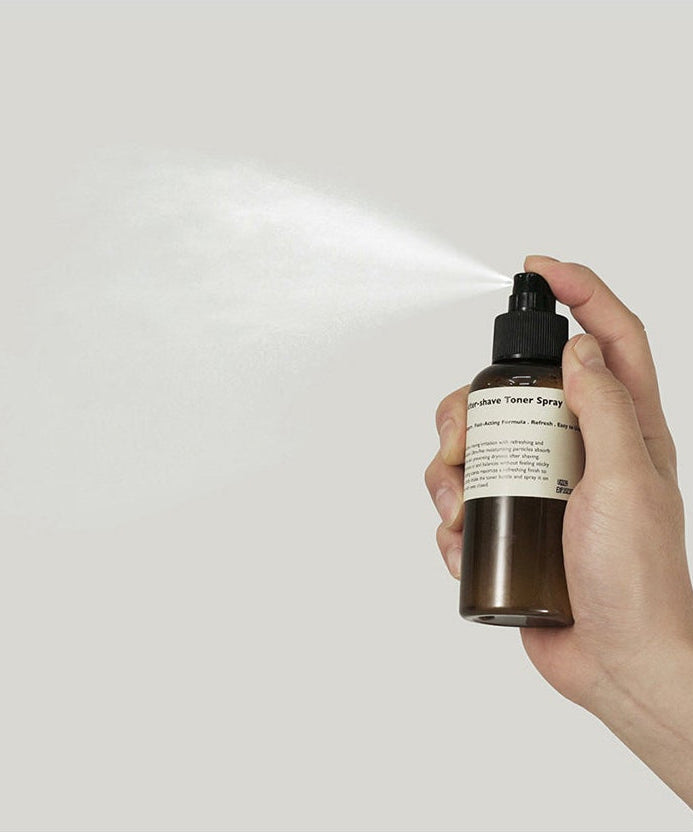 LAZY SOCIETY Cica Aftershave Toner Spray 120ml being sprayed from brown bottle held by hand - Gentleman Korea men’s skincare