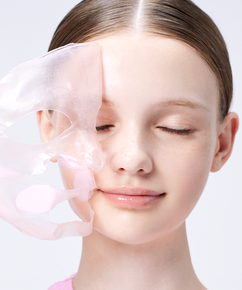 Woman applying COSRX The Peptide Collagen Lifting Glow Hydrogel Mask - 3 sheets