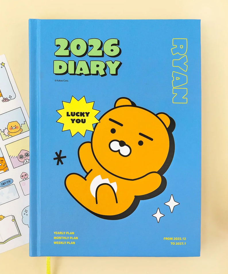 KAKAO FRIENDS Planner 2026 featuring Ryan character on blue cover with stickers, surrounded by stationery items.