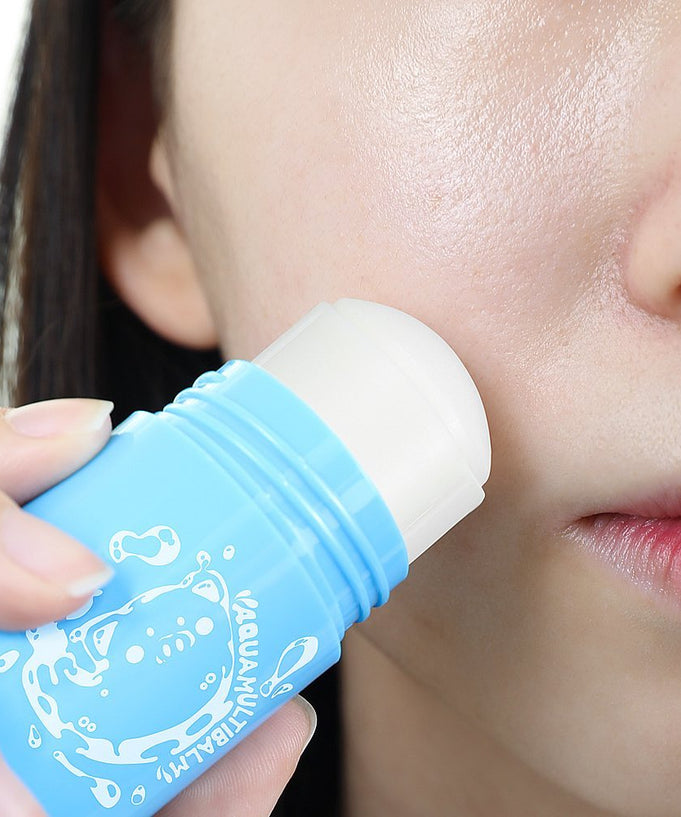 Woman applying ELIZAVECCA Aqua Multii Balm 30g to her face for moisturizing care.