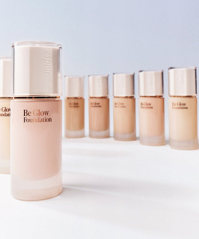 ESPOIR BE GLOW FOUNDATION SPF27 PA++ bottles in various shades. Enhance your skin's radiance with this premium foundation.