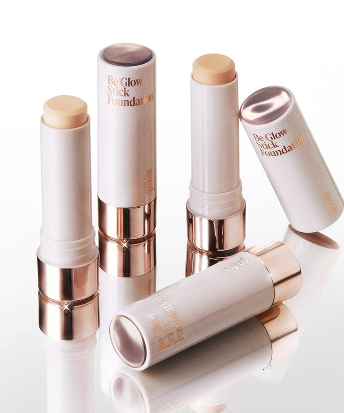 ESPOIR BE GLOW STICK FOUNDATION SPF50+ PA++++ on display with packaging.
