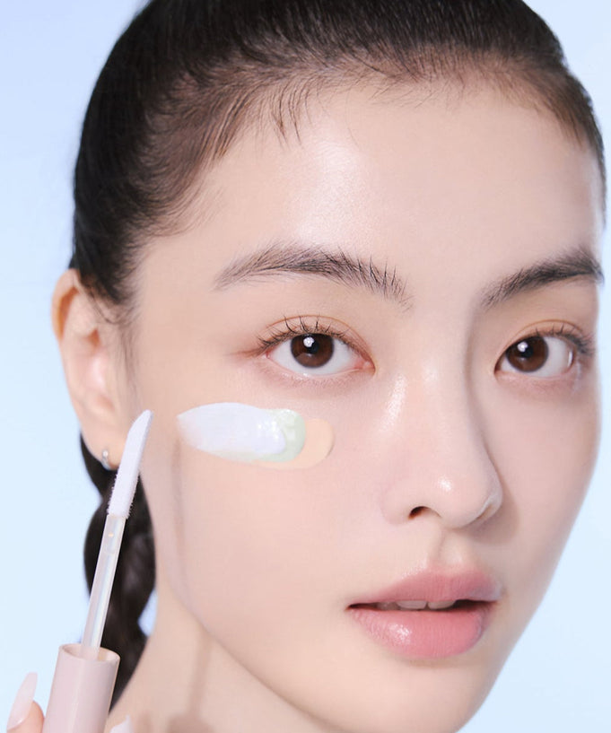 Person applying ESPOIR EASY BLENDING CONCEALER to skin with applicator brush.