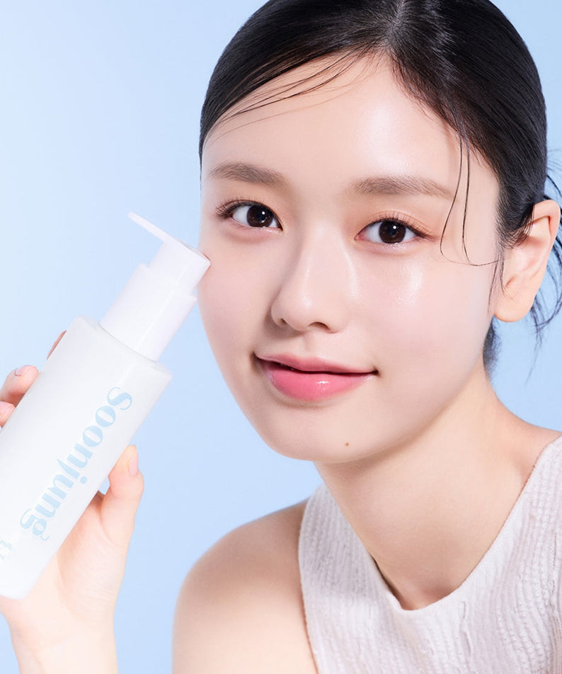Woman holding ETUDE Pure Mildly Acidic Cleansing Milk 200ml in clean beauty skincare routine